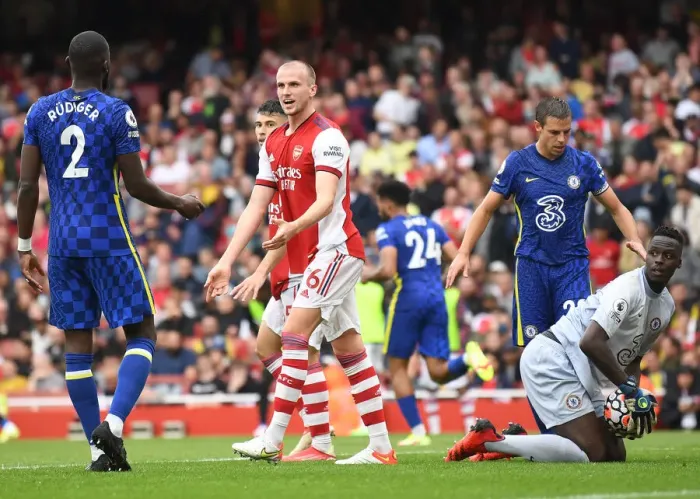 Framed Print : Arsenal vs. Chelsea: Intense Rivalry on the Emirates Field - Holding vs. Rudiger Clash
