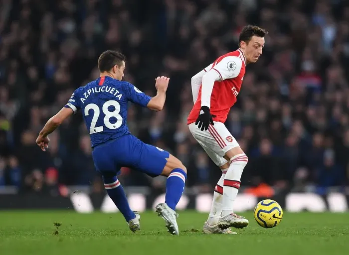 Framed Print : Arsenal vs. Chelsea: Ozil vs. Azpilicueta - Intense Battle in the Premier League