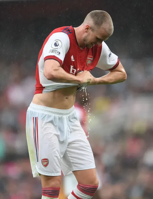 Framed Print : Arsenal vs. Chelsea: Rob Holding Wrings Out Drenched Shirt Amidst Premier League Downpour (2021-22) Framed Print : Arsenal vs. Chelsea: Rob Holding Wrings Out Drenched Shirt Amidst Premier League Downpour (2021-22)