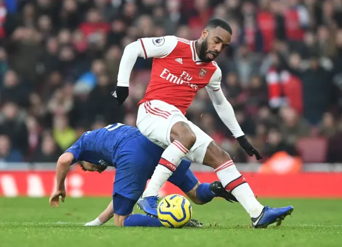 Framed Print : Arsenal vs. Chelsea Showdown: Lacazette vs. Jorginho - A Premier League Battle at Emirates Stadium (2019-20)
