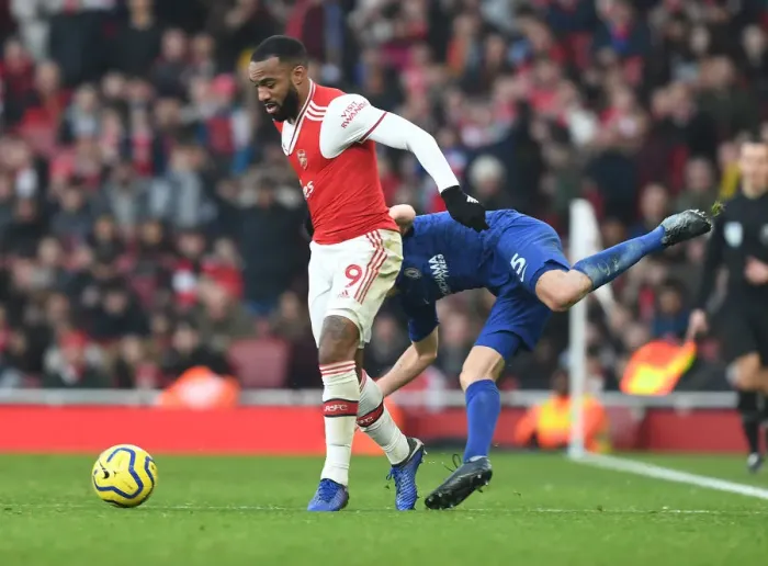 Framed Print : Arsenal vs. Chelsea Showdown: Lacazette vs. Jorginho - Premier League Battle at Emirates Stadium