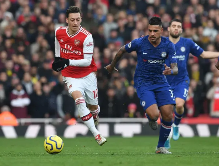 Framed Print : Arsenal vs. Chelsea Showdown: Ozil vs. Emerson Battle at the Emirates