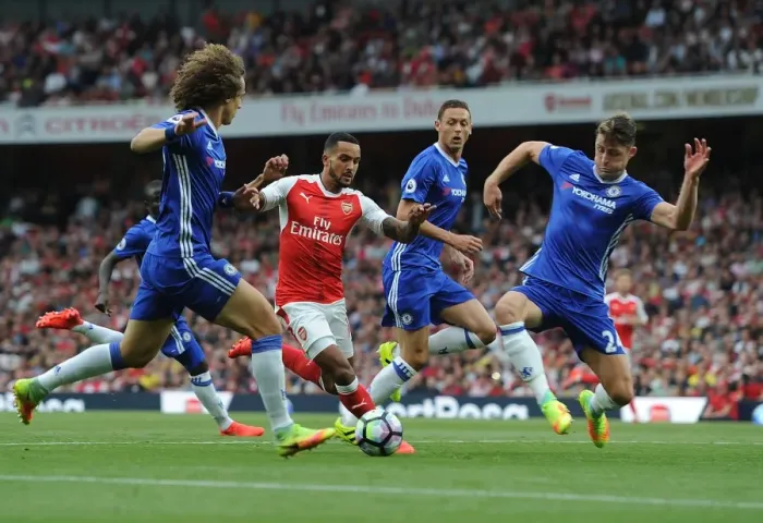 Framed Print : Arsenal vs. Chelsea Showdown: Walcott vs. Luiz and Cahill - A Battle at Emirates