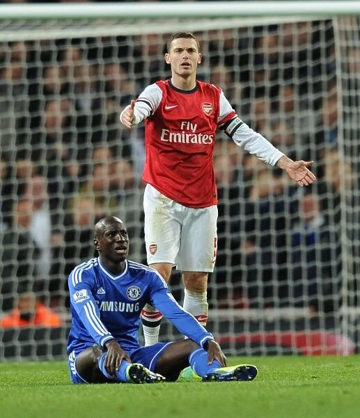 Arsenal vs. Chelsea: Vermaelen Stares Down Ba in Capital One Cup Clash