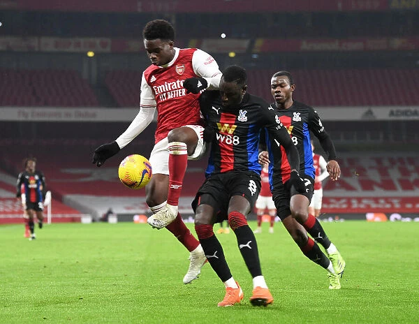 Arsenal vs Crystal Palace: Bukayo Saka Faces Off Against Cheikhou Kouyate in Empty Emirates Stadium