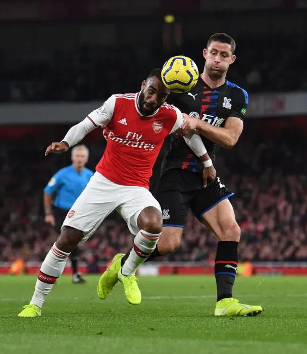 Framed Print : Arsenal vs Crystal Palace: Lacazette Faces Off Against Cahill in Intense Premier League Clash