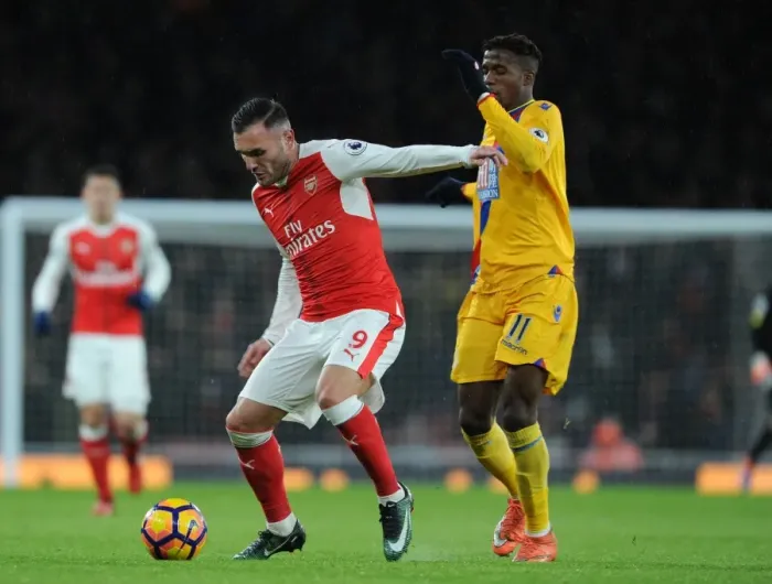 Framed Print : Arsenal vs Crystal Palace: Lucas Perez Clashes with Wilfred Zaha in Premier League Showdown