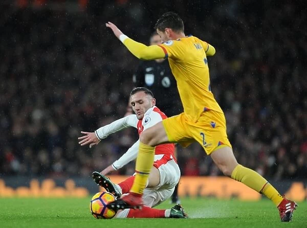 Arsenal vs. Crystal Palace: Lucas Perez Tackles Joel Ward in Premier League Clash at Emirates Stadium