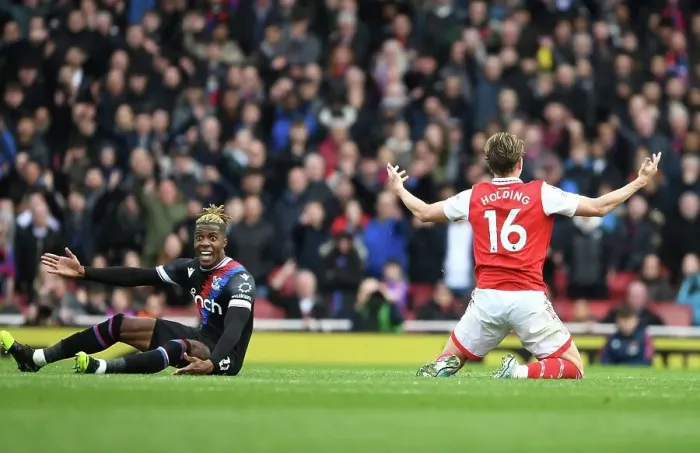 Framed Print : Arsenal vs Crystal Palace: Rob Holding and Wilfred Zaha Clash in Premier League Showdown at Emirates Stadium Framed Print : Arsenal vs Crystal Palace: Rob Holding and Wilfred Zaha Clash in Premier League Showdown at Emirates Stadium