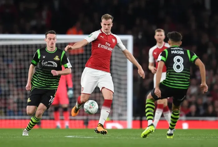 Framed Print : Arsenal vs Doncaster Rovers: Rob Holding Clashes with Liam Mandeville in Carabao Cup Showdown