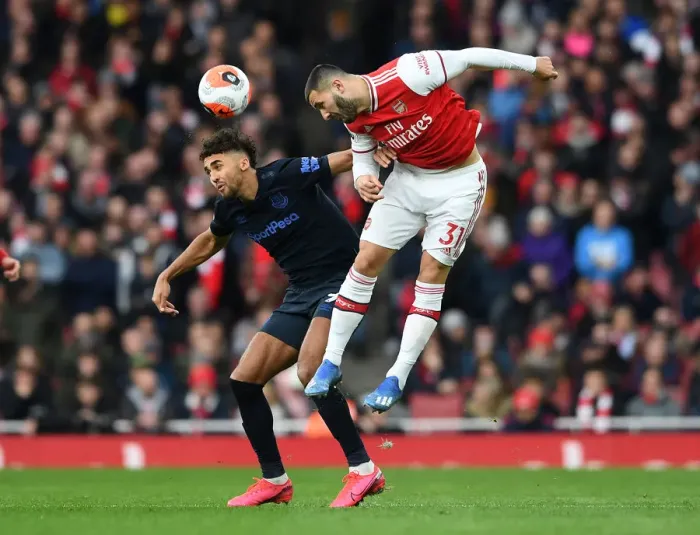 Framed Print : Arsenal vs Everton: Kolasinac Heads Off Under Pressure in Intense Premier League Clash