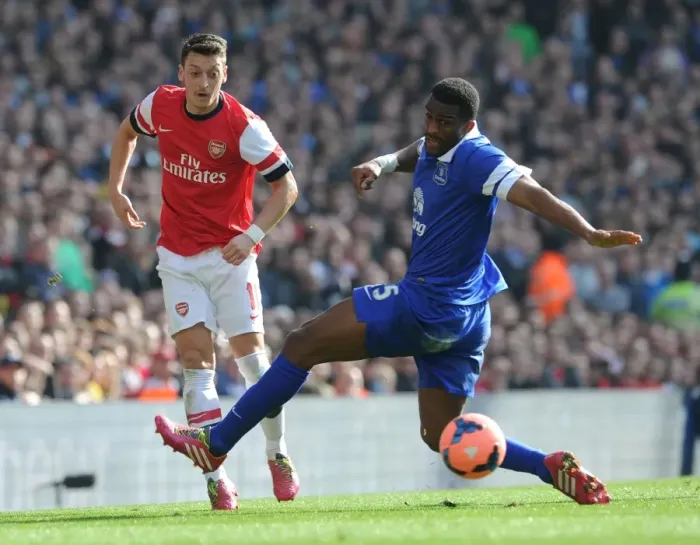 Framed Print : Arsenal vs. Everton: Ozil Evades Distin in FA Cup Quarter-Final Showdown