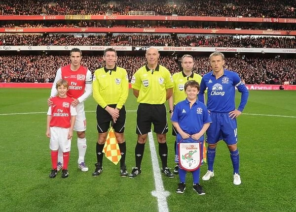 Arsenal vs. Everton: Premier League Clash - Robin van Persie and Phil Neville Lead Teams Out at Emirates Stadium (December 2011)