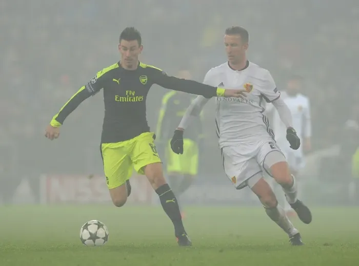 Framed Print : Arsenal vs. FC Basel: Laurent Koscielny Faces Off Against Marc Janko in 2016-17 UEFA Champions League Clash