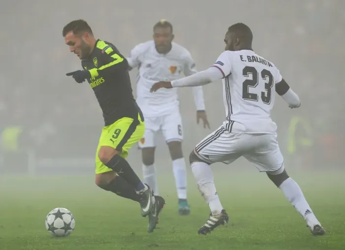 Framed Print : Arsenal vs. FC Basel: Lucas Perez Clashes with Eder Balanta in 2016-17 UEFA Champions League