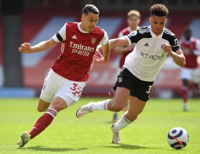Framed Print : Arsenal vs Fulham: Martinelli Takes on Robinson in Empty Emirates Stadium, Premier League 2020-21 Framed Print : Arsenal vs Fulham: Martinelli Takes on Robinson in Empty Emirates Stadium, Premier League 2020-21