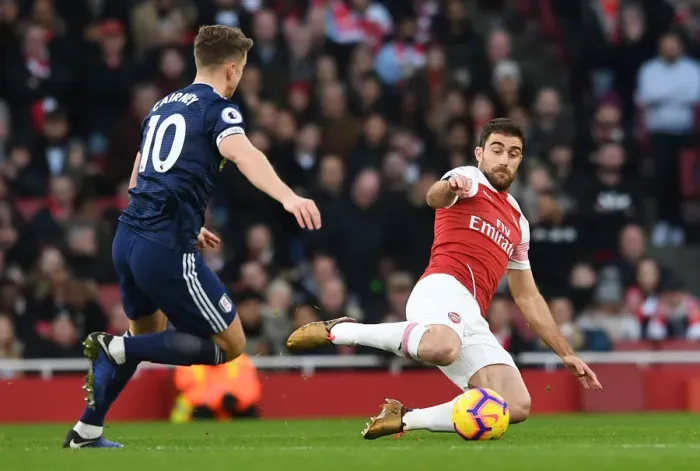 Framed Print : Arsenal vs. Fulham: Sokratis Fends Off Tom Cairney's Pressure in Premier League Clash Framed Print : Arsenal vs. Fulham: Sokratis Fends Off Tom Cairney's Pressure in Premier League Clash