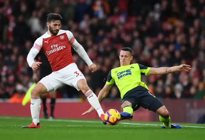 Framed Print : Arsenal vs. Huddersfield: Sead Kolasinac vs. Jonathan Hogg in Intense Premier League Clash