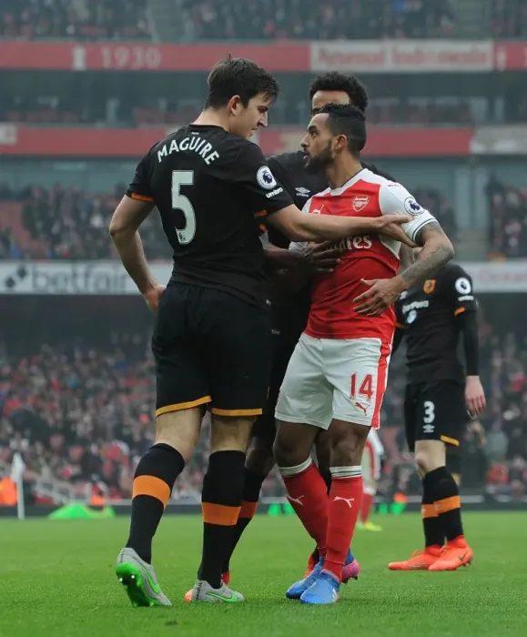 Framed Print : Arsenal vs Hull City: Walcott vs Maguire - A Fierce On-Field Showdown