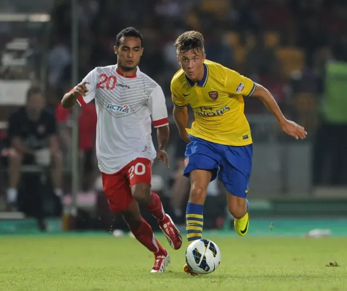 Framed Print : Arsenal vs Indonesia All-Stars: Kris Olsson vs Rizky Ripora in Action