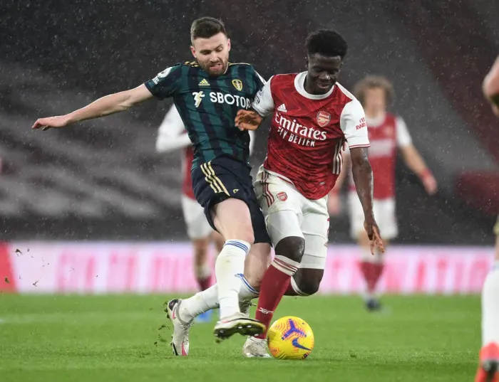Framed Print : Arsenal vs Leeds United: Bukayo Saka Clashes with Stuart Dallas in Premier League Showdown Framed Print : Arsenal vs Leeds United: Bukayo Saka Clashes with Stuart Dallas in Premier League Showdown