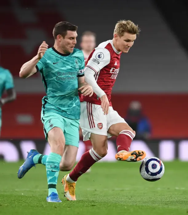 Framed Print : Arsenal vs Liverpool: A Battle at Emirates Amidst Empty Stands (2020-21)