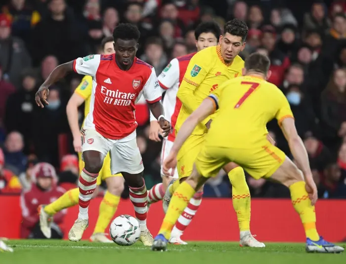 Framed Print : Arsenal vs Liverpool: Bukayo Saka Clashes with James Milner in Carabao Cup Semi-Final Showdown Framed Print : Arsenal vs Liverpool: Bukayo Saka Clashes with James Milner in Carabao Cup Semi-Final Showdown
