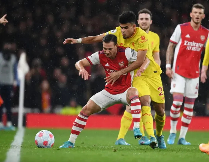 Framed Print : Arsenal vs Liverpool: Cedric Holds Off Luis Diaz in Intense Premier League Clash Framed Print : Arsenal vs Liverpool: Cedric Holds Off Luis Diaz in Intense Premier League Clash
