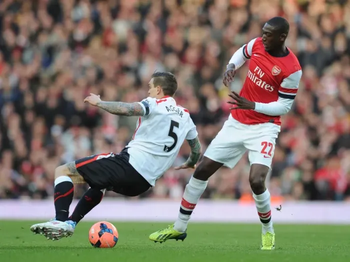 Framed Print : Arsenal vs. Liverpool: Clash in the FA Cup Fifth Round - Yaya Sanogo vs. Daniel Agger