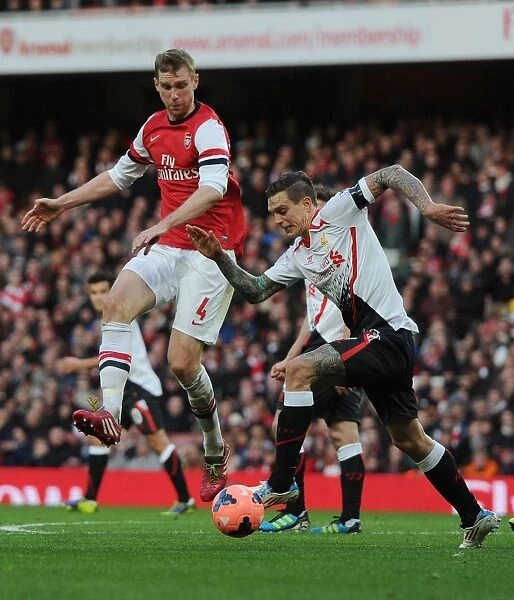 Arsenal vs. Liverpool: Per Mertesacker Blocks Daniel Agger in FA Cup Fifth Round Clash