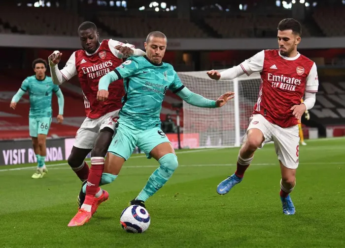 Framed Print : Arsenal vs. Liverpool: Pepe and Ceballos Clash in Intense Premier League Showdown