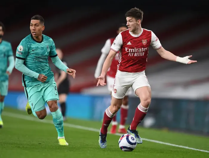 Framed Print : Arsenal vs. Liverpool Showdown: A Clash of Stars - Kieran Tierney vs. Roberto Firmino