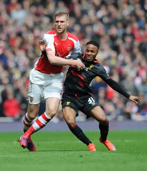 Framed Print : Arsenal vs. Liverpool Showdown: Mertesacker vs. Sterling