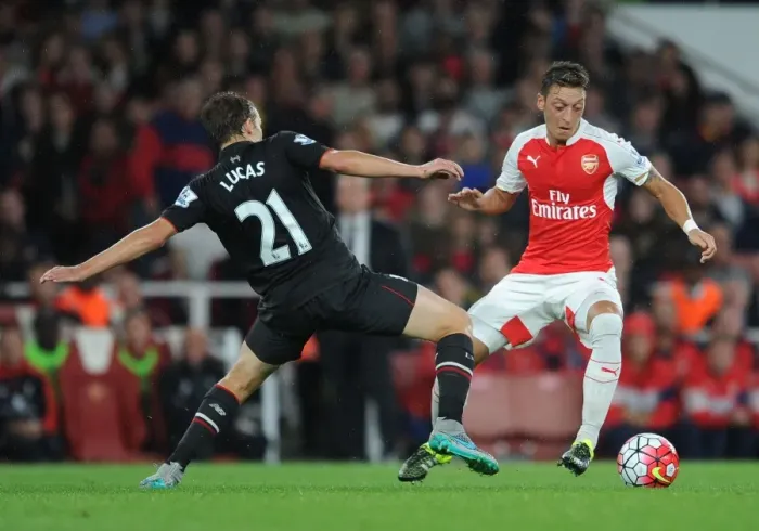 Framed Print : Arsenal vs. Liverpool Showdown: Ozil vs. Leiva Clash in the 2015 / 16 Premier League