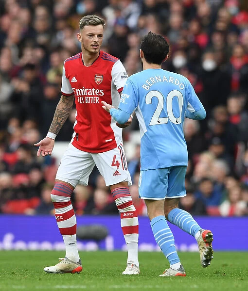 Arsenal vs Manchester City: Ben White and Bernardo Silva in Deep Conversation during the 2021-22 Premier League Clash at Emirates Stadium