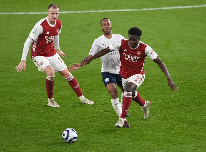 Framed Print : Arsenal vs Manchester City: Bukayo Saka vs Raheem Sterling Clash in Empty Emirates Stadium, Premier League 2020-21