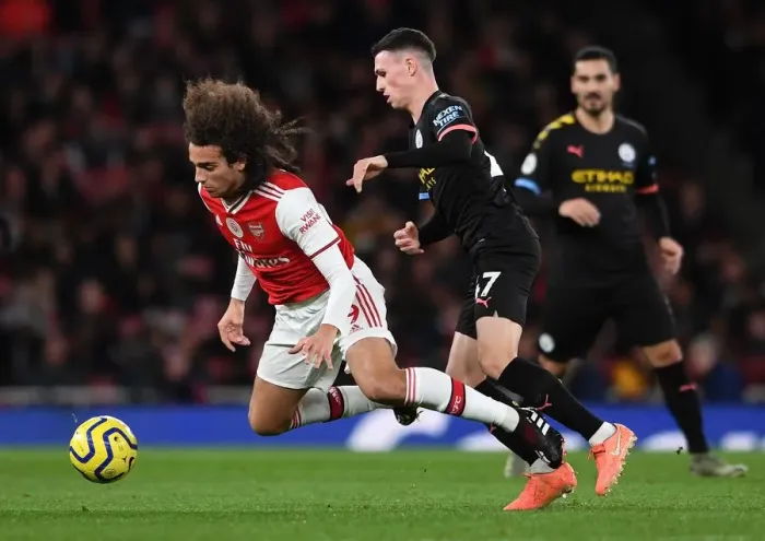 Framed Print : Arsenal vs Manchester City: Guendouzi Tripped by Foden in Intense Premier League Clash (2019-20)