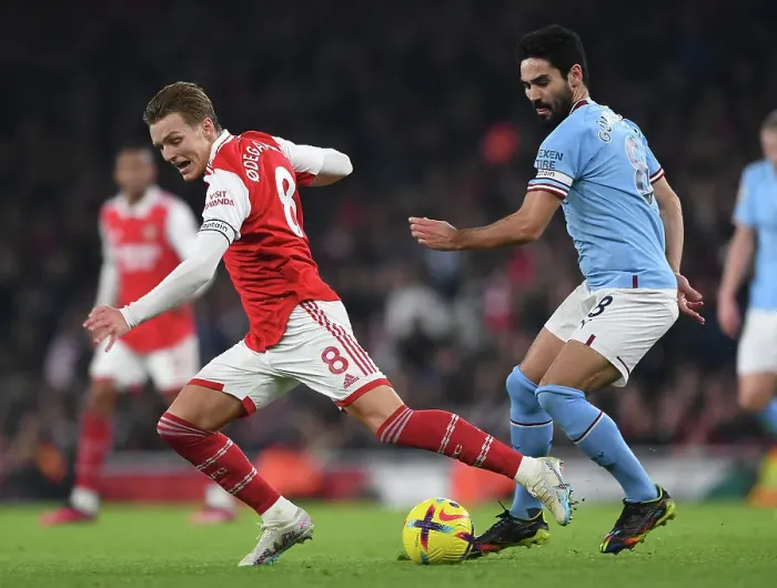 Framed Print : Arsenal vs Manchester City: Intense Battle between Odegaard and Gundogan in the 2022-23 Premier League Framed Print : Arsenal vs Manchester City: Intense Battle between Odegaard and Gundogan in the 2022-23 Premier League