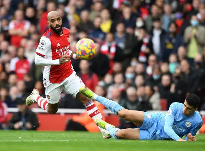 Framed Print : Arsenal vs Manchester City: Lacazette vs Cancelo - Premier League Clash at Emirates Stadium (2021-22)