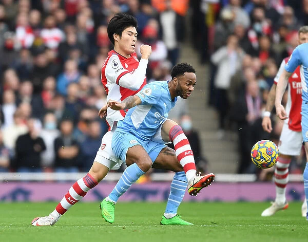 Arsenal vs Manchester City: Tomiyasu Tackles Sterling in Intense Premier League Clash