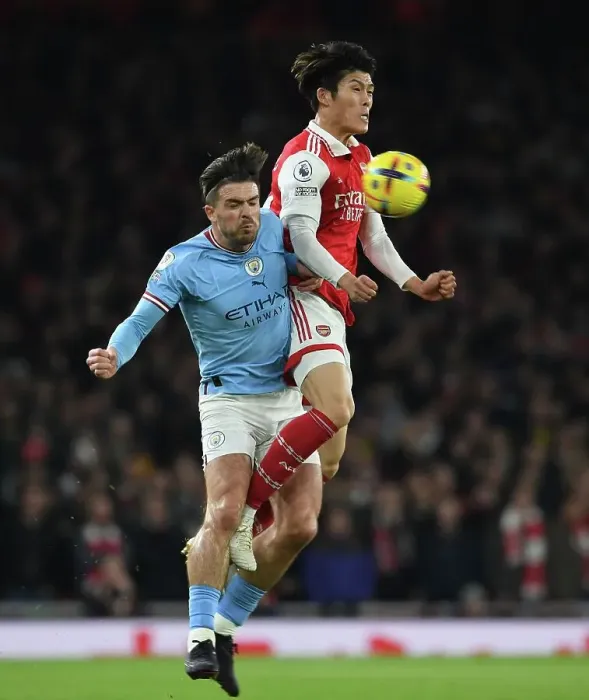 Framed Print : Arsenal vs Manchester City: Tomiyasu vs Grealish Clash in Premier League Showdown