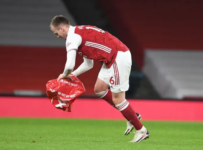 Framed Print : Arsenal vs Manchester United: Rob Holding Clears Object from Empty Emirates Stadium during Premier League Match Amid Coronavirus Restrictions (2020-21) Framed Print : Arsenal vs Manchester United: Rob Holding Clears Object from Empty Emirates Stadium during Premier League Match Amid Coronavirus Restrictions (2020-21)