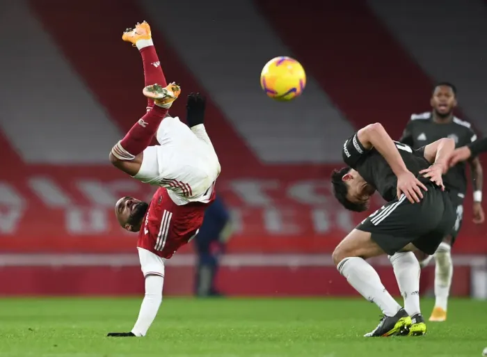 Framed Print : Arsenal vs Manchester United: Lacazette Falls After Challenge with Maguire in Empty Emirates Stadium (Premier League 2020-21) Framed Print : Arsenal vs Manchester United: Lacazette Falls After Challenge with Maguire in Empty Emirates Stadium (Premier League 2020-21)