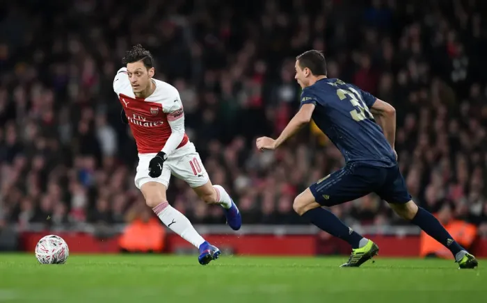 Framed Print : Arsenal vs Manchester United: Clash of Titans in the FA Cup Fourth Round - Ozil vs Matic Battle