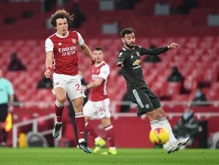 Framed Print : Arsenal vs Manchester United: David Luiz Shoots Under Pressure in Empty Emirates Stadium, Premier League 2020-21