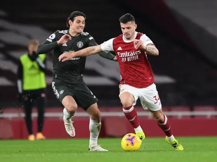 Framed Print : Arsenal vs Manchester United: Granit Xhaka vs Edinson Cavani Clash in Empty Emirates Stadium, Premier League 2020-21 Framed Print : Arsenal vs Manchester United: Granit Xhaka vs Edinson Cavani Clash in Empty Emirates Stadium, Premier League 2020-21
