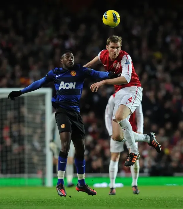 Framed Print : Arsenal vs Manchester United: Intense Moment Between Per Mertesacker and Danny Welbeck Framed Print : Arsenal vs Manchester United: Intense Moment Between Per Mertesacker and Danny Welbeck