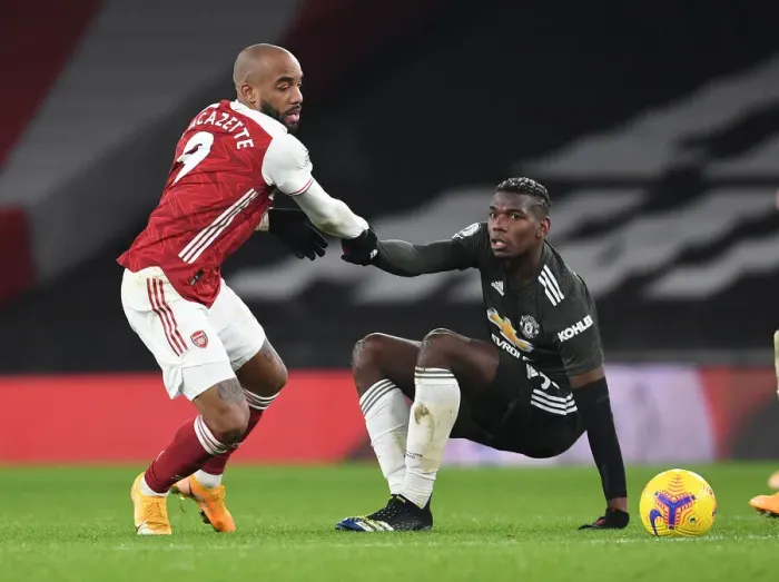 Framed Print : Arsenal vs Manchester United: Lacazette Consoles Pogba Amid Empty Emirates Stadium (2020-21)