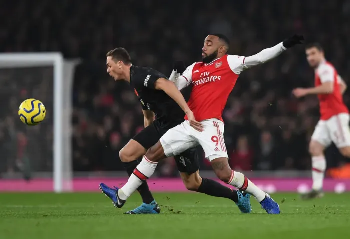 Framed Print : Arsenal vs Manchester United: Lacazette Tackles Matic in Intense Premier League Clash (2019-20)