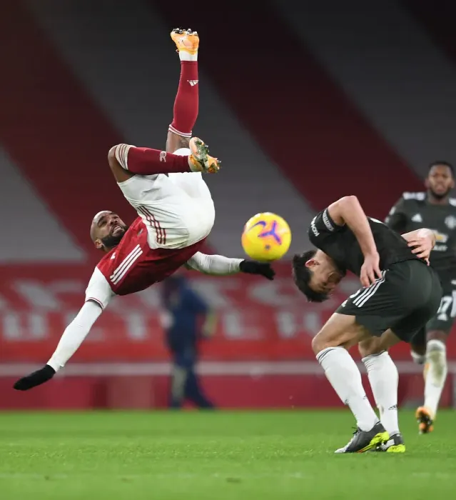 Framed Print : Arsenal vs Manchester United: Lacazette Tangles with Maguire in Empty Emirates Stadium Framed Print : Arsenal vs Manchester United: Lacazette Tangles with Maguire in Empty Emirates Stadium